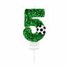 Green glitter number 5 candle with a soccer ball design for a birthday celebration