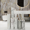 A collection of white marble contact paper rolls displayed in a bathroom setting.