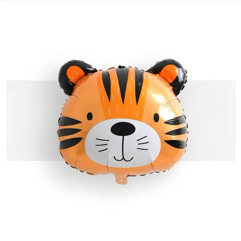 An inflatable orange and black tiger face decoration for birthday decor.