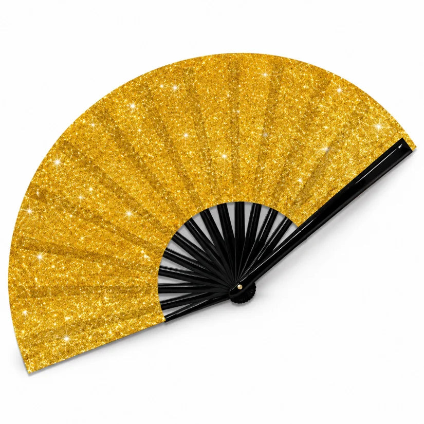 A golden glitter hand fan with black ribs, shown open and angled.