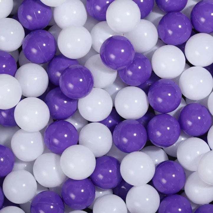 A close-up view of a 50-pack of colorful purple and white star-shaped plastic balls for kids' play.