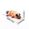 A set of three light orange and brown 3D printed cartoon animal figurines resembling chicks or baby birds.