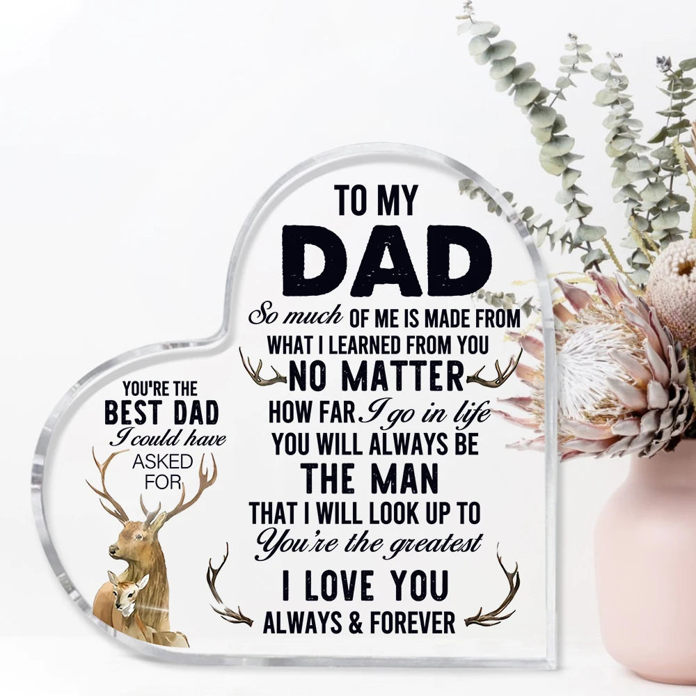 A clear heart-shaped glass sign with black text saying To My Dad So much of me is made from what I learned from you You're th