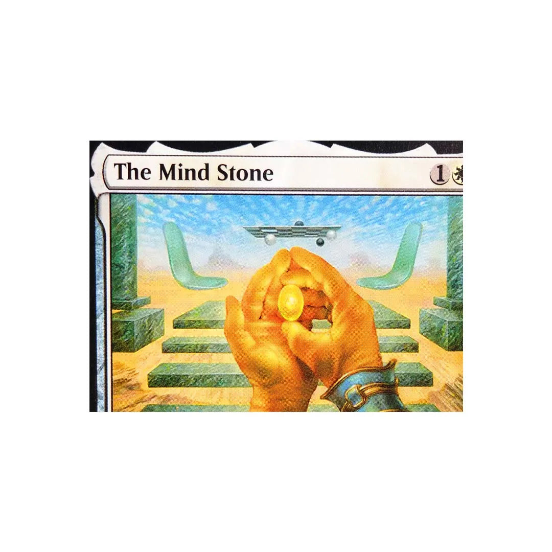 A fantasy art trading card titled The Mind Stone showing a hand holding a glowing yellow stone above green steps.