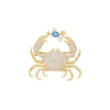 Gold vintage marine life brooch pin set featuring a crab and stars with blue gemstones