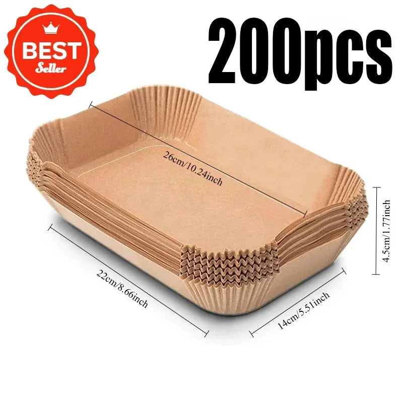 Une pile de 200 dosettes rectangulaires de papier cuisson extra-grandes pour friteuse à air.