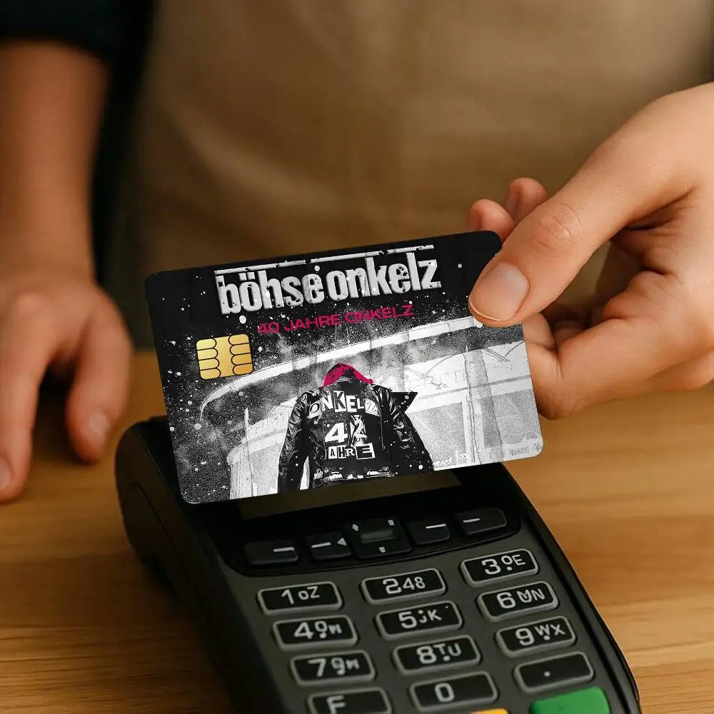 A hand holds a reusable credit card protection sticker featuring the text böhse onkelz on a black background.