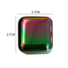 A square, translucent green and purple stainless steel ice cube with dimensions of 2.7cm by 2.7cm.