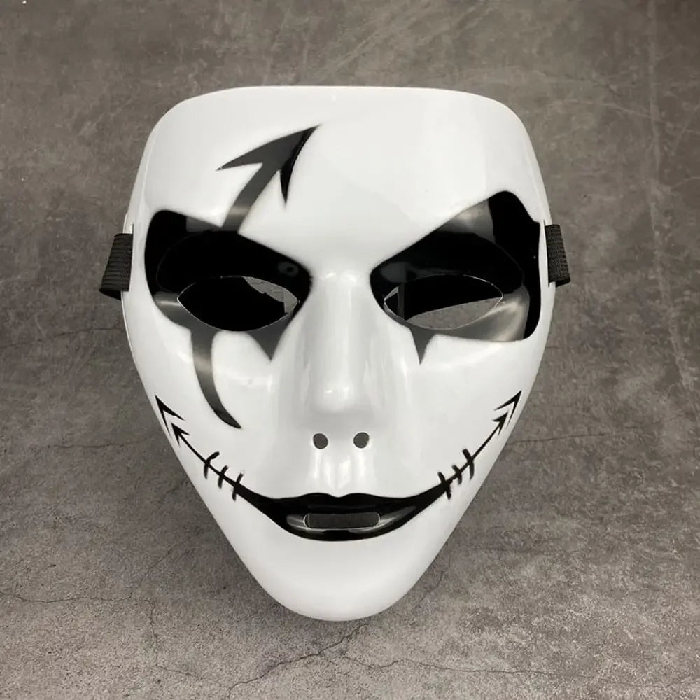 A white masquerade mask with black markings and an ancient style design.