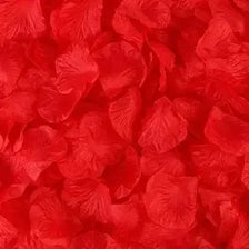Close-up of vibrant red simulation silk rose petals used for event decor.