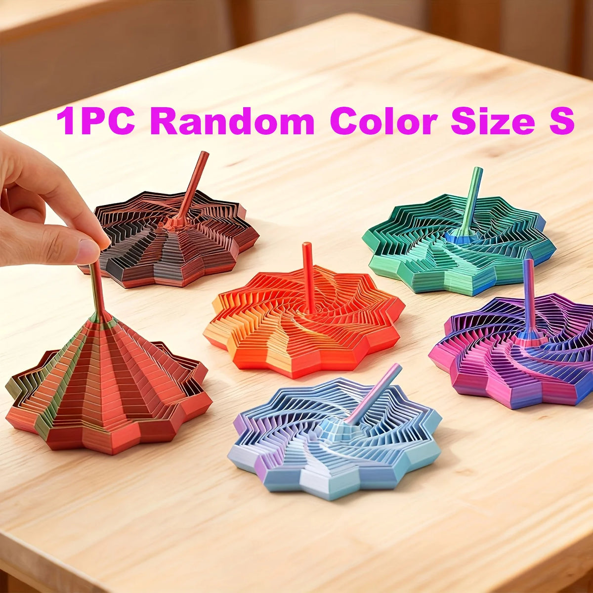 A hand holds a 1PC random color size S 3D-printed star fidget spinner with handle, showing various colored geometric shapes.