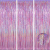 A vertical backdrop featuring shimmering pink and purple metallic foil tinsel fringe strands.