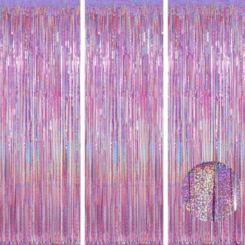 A vertical backdrop featuring shimmering pink and purple metallic foil tinsel fringe strands.