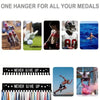 A collection of various medals and awards displayed on a wall-mounted metal hanger rack.