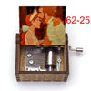 A hand-cranked wooden music box featuring an illustration of two figures in historical attire.