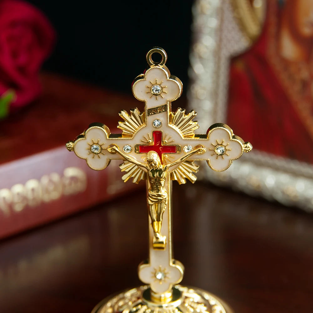 Elegant gold metal Jesus cross ornament with a floral top and base.