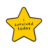 Yellow star enamel pin with the text I survived today on it.