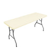 A rectangular table with a light beige stretch elastic tablecloth cover and black metal legs.
