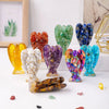 A collection of natural crystal guardian angel figurines in various colors and shapes.