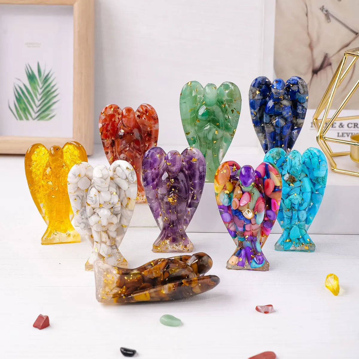 A collection of natural crystal guardian angel figurines in various colors and shapes.