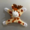 A plush toy resembling a giraffe head with orange and white spots and brown tufts of hair.