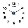 A modern 3D acrylic wall clock face showing the time as 12:00 with black hands and white numbers.