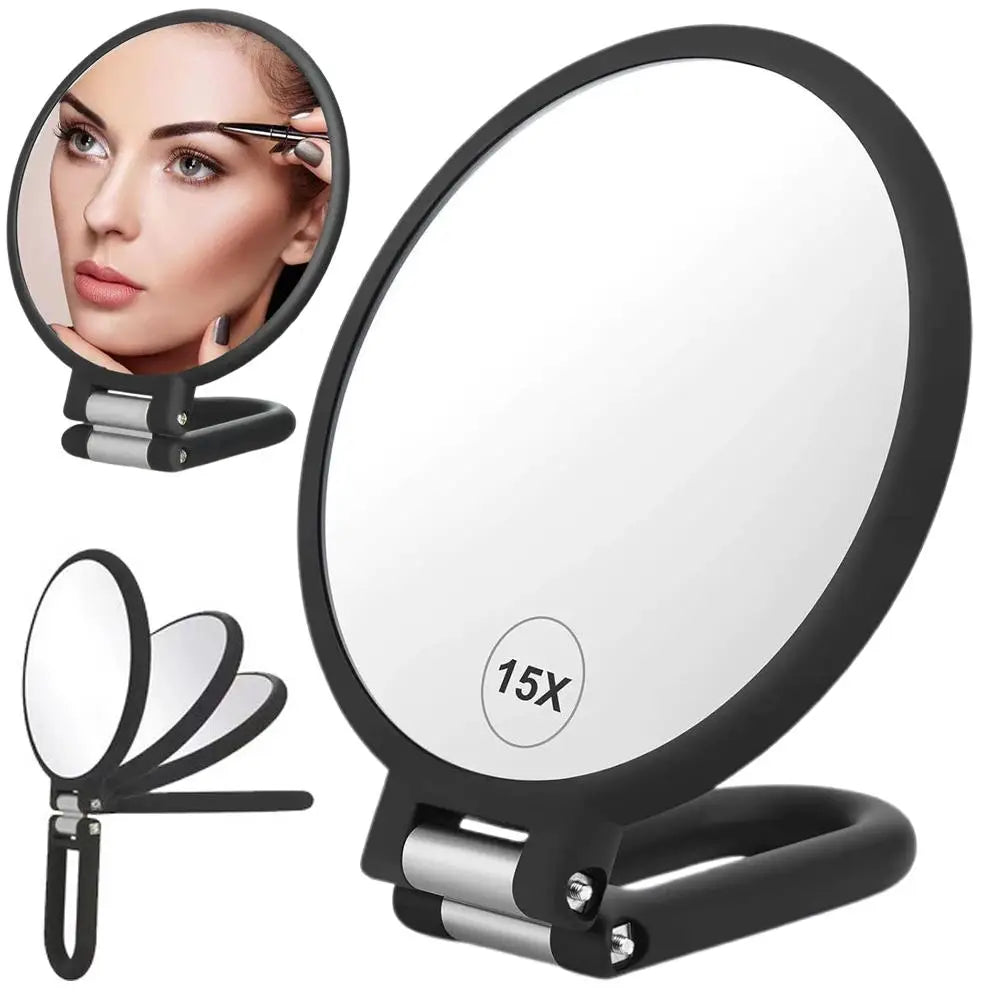 A black handheld mirror with a circular magnifying lens and a stand is shown.