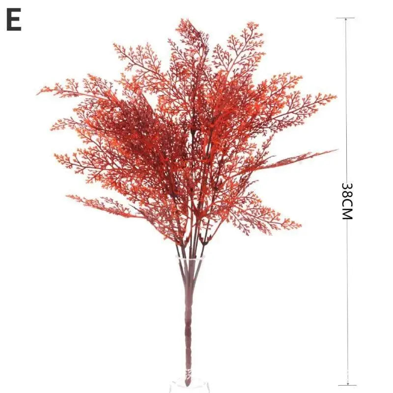 Artificial fall flower bouquet with reddish-orange branches on a stand