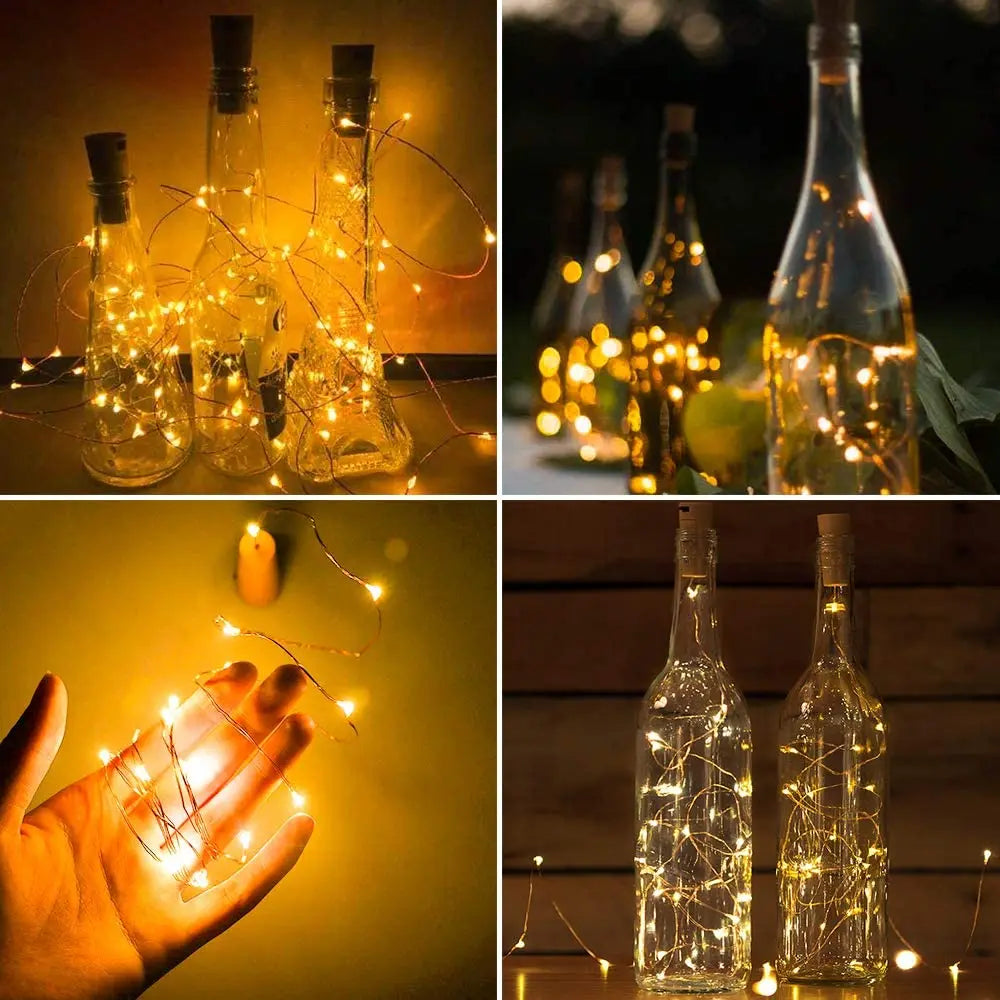 A set of ten LED string lights are placed inside glass wine bottles, illuminating the bottles.