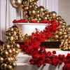 A lavish balloon garland featuring metallic chrome gold and deep red floral arrangements for an event backdrop.