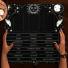 A dark cloth featuring a Celtic Cross design with celestial symbols and empty boxes for tarot readings.