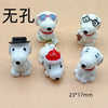 A collection of white ceramic dog pendants in various styles, including sunglasses, glasses, and a hat, for jewelry making.