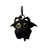 A black, fuzzy seal plush keychain with large yellow eyes and a metal loop.