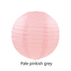 A round, translucent pink paper lantern with a crinkled texture.