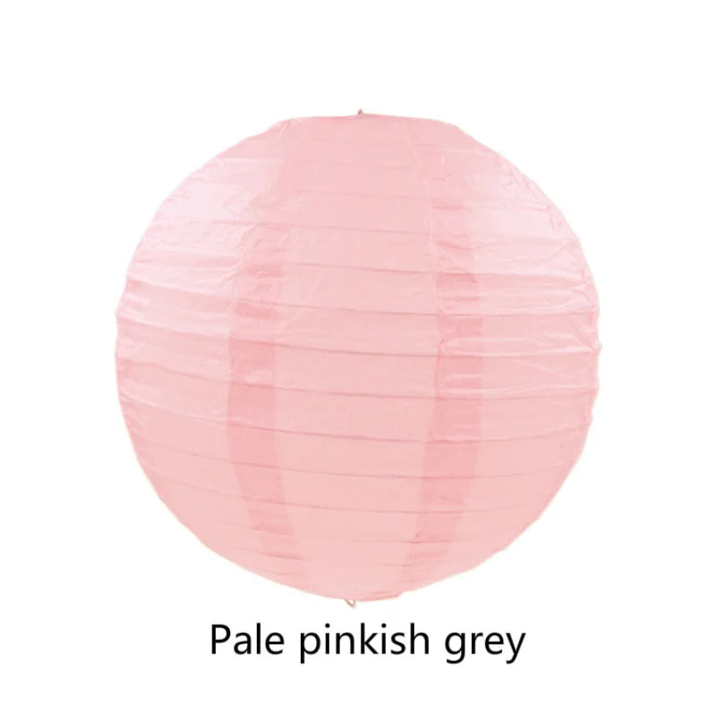 A round, translucent pink paper lantern with a crinkled texture.