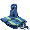 A blue canvas camping hammock with straps and a storage bag, shown folded and hanging.