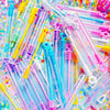 A colorful assortment of clear and colored mini bubble bottles for parties