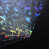A close-up view of holographic card sleeves showing iridescent colors and light refraction.