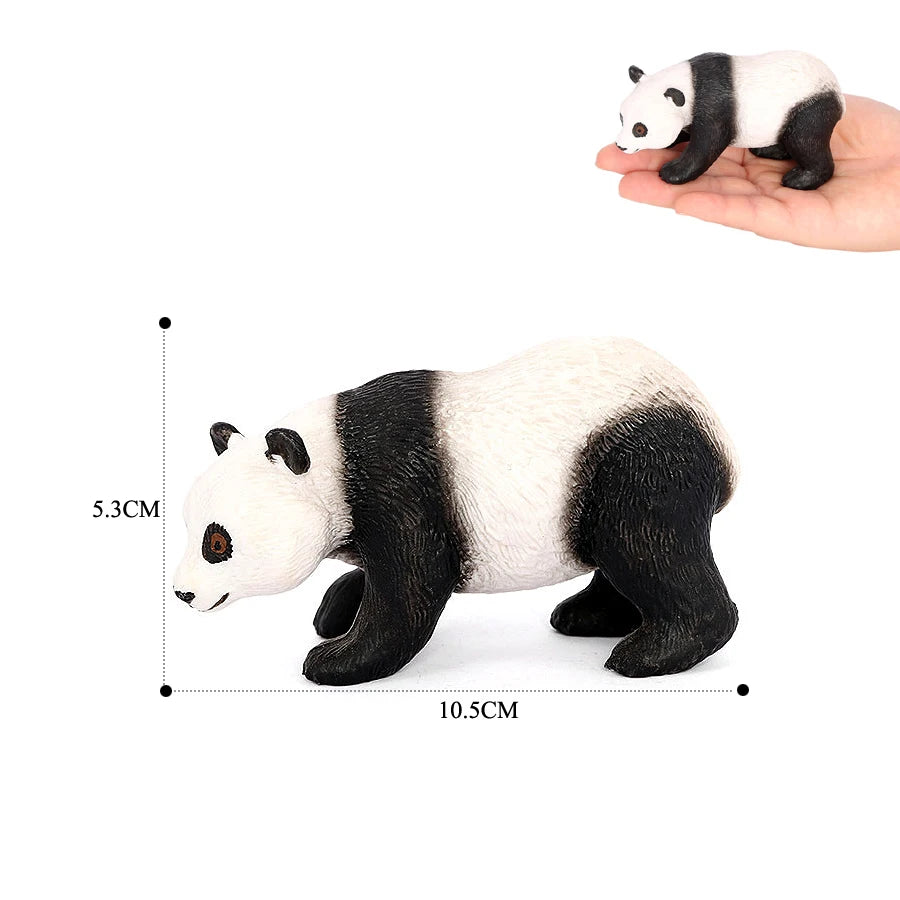A realistic panda figurine showing a black and white coat, held in a hand for scale.