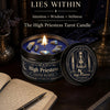 A dark candle in a tin holds crystal stones, set against a background featuring the High Priestess Tarot theme.