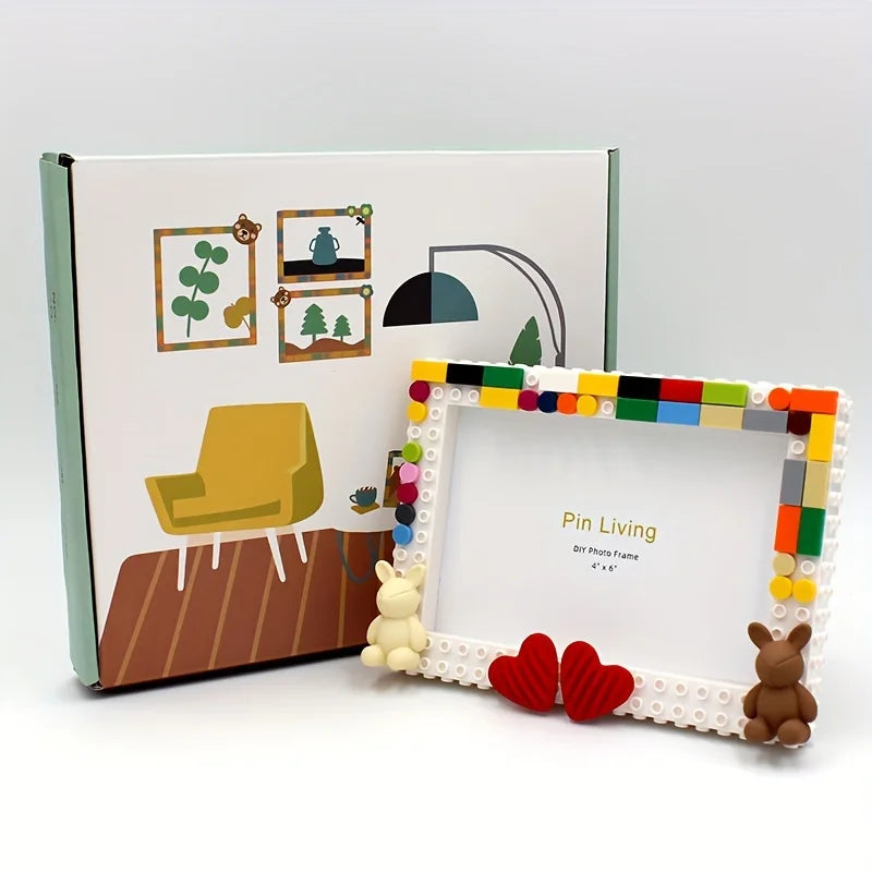 A wooden photo frame with a white mat and colorful blocks, featuring illustrations of a teapot and trees.