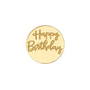 A round gold acrylic topper with the words Happy Birthday written in a cursive font.