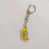 Acrylic keychain featuring a cute yellow banana cat character.