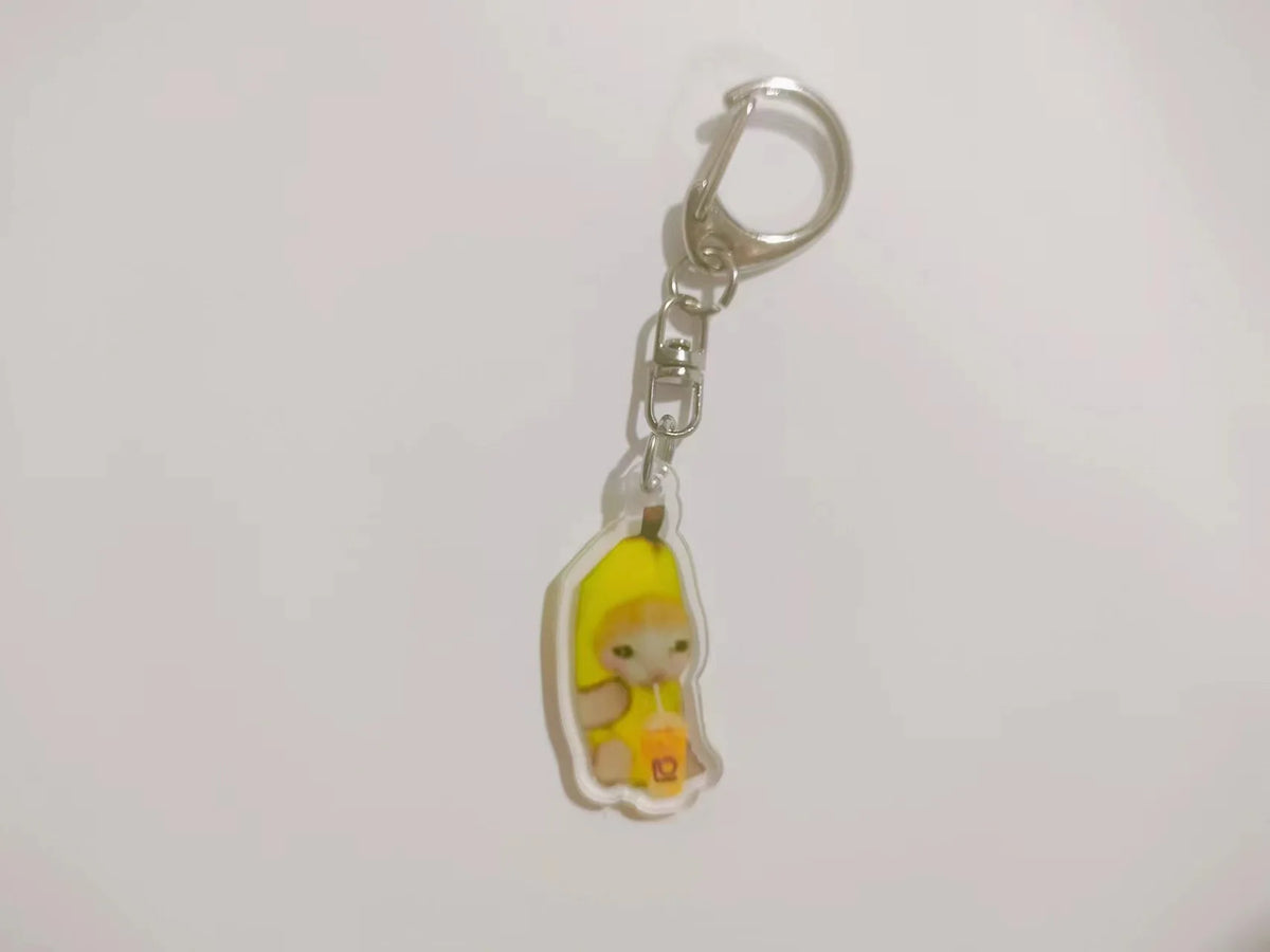 Acrylic keychain featuring a cute yellow banana cat character.