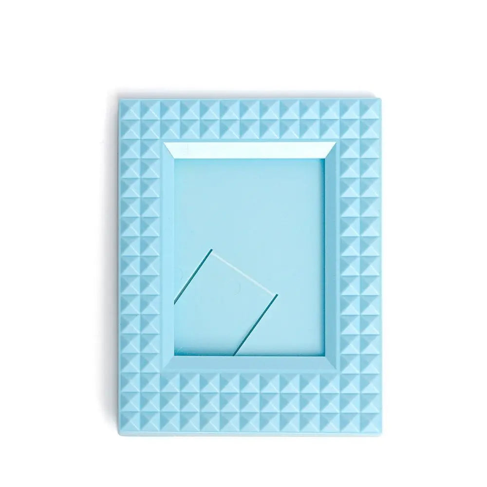 Light blue mini film frame with a diamond pattern border and a square opening