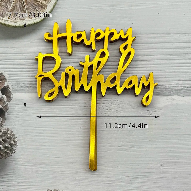 Gold acrylic birthday cake topper with the words Happy Birthday on a stick