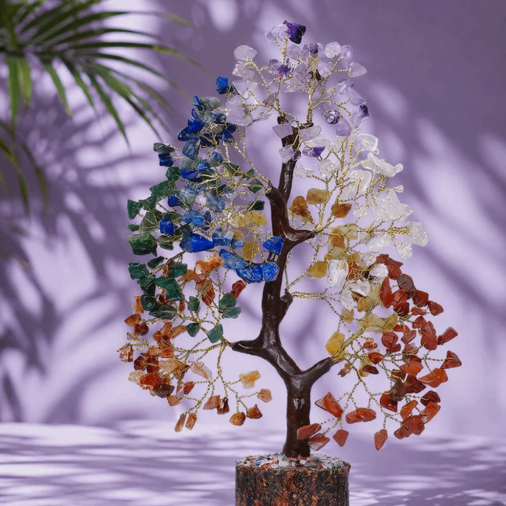 A bendable crystal tree ornament with branches adorned by various colored crystals and leaves.
