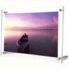 An acrylic photo frame displaying a sunset over the ocean with a small boat silhouette.