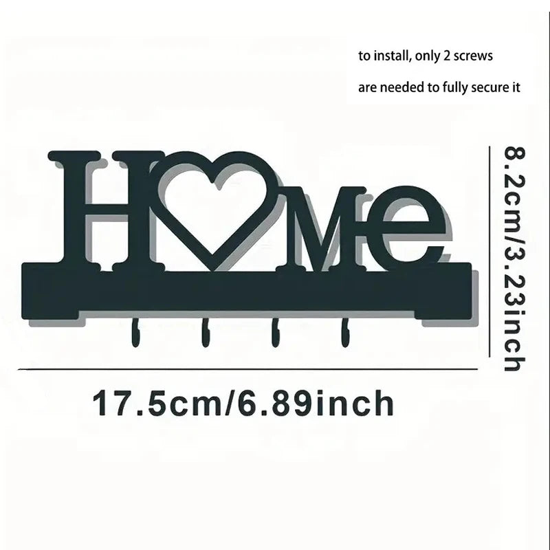 A black letter-shaped metal wall key holder spelling HOME with four hooks.