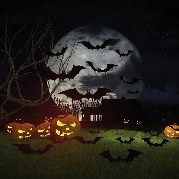 A spooky Halloween scene featuring a large full moon, bats, and carved pumpkins on a grassy field.